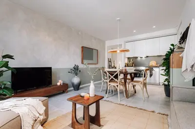 a living room with a couch and a table at Mojacar - 2 bedrooms in Eixample Esquerra in Barcelona