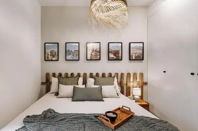 a kitchen with white cabinets and a stove top oven at Botijo - 2 bedrooms in Eixample Esquerra in Barcelona
