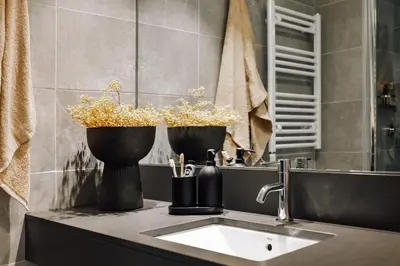 a bathroom with a white sink and a shower at Botijo - 2 bedrooms in Eixample Esquerra in Barcelona