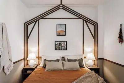 a bedroom with a bed and a sink and a mirror at Botijo - 2 bedrooms in Eixample Esquerra in Barcelona