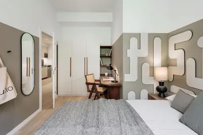 a bedroom with a large bed with two lamps at Brisa - 1 bedroom and balcony in Sant Antoni in Barcelona