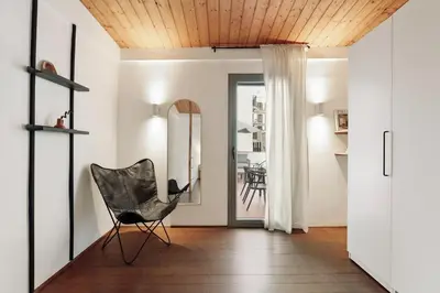 a living room with a couch and a table at Panot - 2 bedrooms and terrace in Gràcia in Barcelona