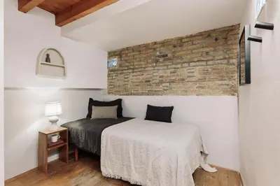 a laundry room with a washing machine in a bathroom at Panot - 2 bedrooms and terrace in Gràcia in Barcelona