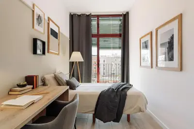 a kitchen with a table and a dining room at Murtra - 2 bedrooms in Sant Antoni in Barcelona