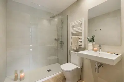 a bedroom with a bed and a desk and a window at Murtra - 2 bedrooms in Sant Antoni in Barcelona