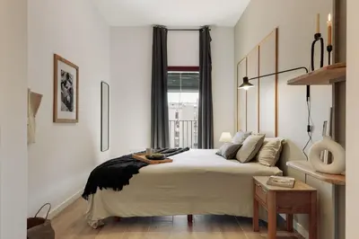 a bedroom with a large bed and a window at Murtra - 2 bedrooms in Sant Antoni in Barcelona