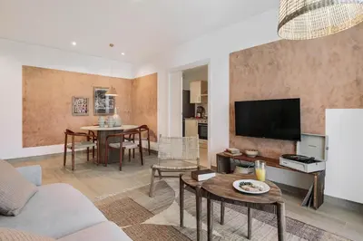 a bedroom with a large bed and a large window at Sole - 2 bedrooms in Poblenou in Barcelona