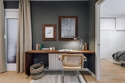 a kitchen with white cabinets and a sink and an oven at Arros - 2 bedroom in El Born in Barcelona