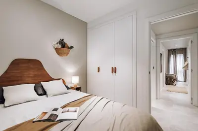 a bedroom with a bed with two books on it at Encina - 2 bedrooms in Eixample Esquerra in Barcelona