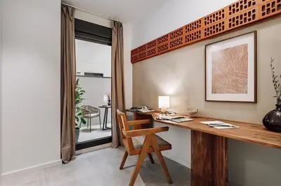 a living room with a couch and a table at Encina - 2 bedrooms in Eixample Esquerra in Barcelona