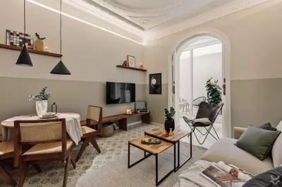 a living room with a couch and a table at Halite - 2 bedrooms, terrace, and balcony in Gràcia in Barcelona