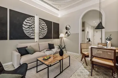 a kitchen with white cabinets and a stove top oven at Halite - 2 bedrooms, terrace, and balcony in Gràcia in Barcelona