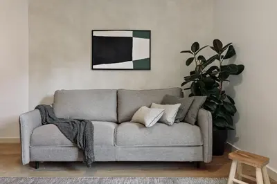 a living room with a desk with a computer on it at Canet - 1 bedroom in Ciutat Vella in Barcelona