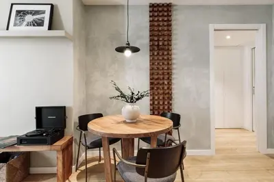 a living room with a large flat screen tv on a wall at Ebre - 1 bedroom and balcony in Eixampre Esquerre in Barcelona