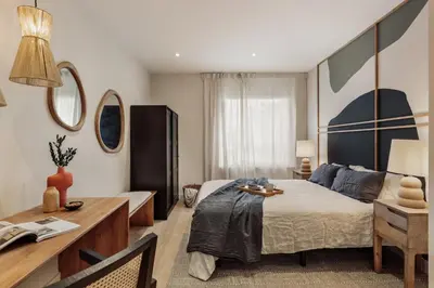 a bedroom with a bed and a large mirror at Yaz - 2 bedrooms and balcony in El Putxet in Barcelona