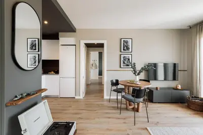 a kitchen and living room with a table and chairs at Roc - 2 bedrooms in Poblenou in Barcelona