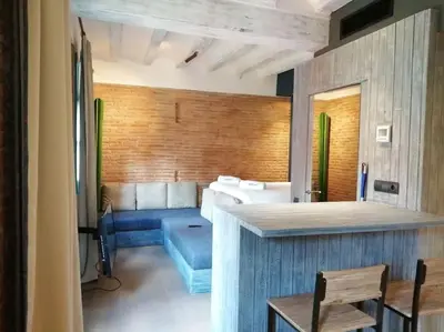 a hotel room with a bed and a table and chairs at Barceloneta Mar Street - BM11 in Barcelona