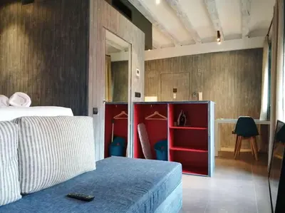 a bedroom with a bed and a red cabinet at Barceloneta Mar Street - BM11 in Barcelona