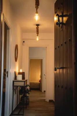 a hallway with a door leading to a bedroom at Habitación L'Elefant en Casa Camí de les Aigües Monistrol de Montserrat in Monistrol