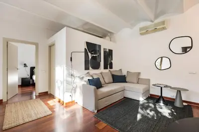 a living room with a couch and a table at Enjoy Apartments Urban Retreat Valencia 3 in Barcelona