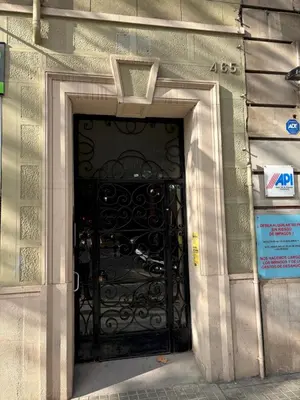 a black door in the side of a building at Enjoy Apartments Urban Retreat Valencia 3 in Barcelona