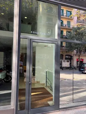 a glass door of a building on a city street at Enjoy Apartments Calle Paris Super Stylish II in Barcelona