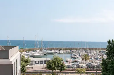 a marina filled with lots of boats in the water at ecoGrusApartments in Masnou