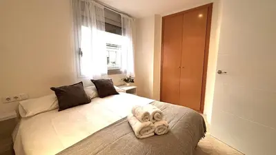 a bedroom with a bed with a stuffed animal on it at Dúplex ático familiar by Prestigi in Terrassa