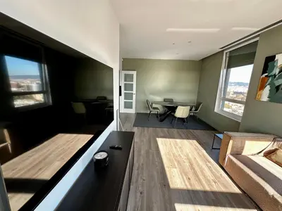 a living room with a couch and a table at The Olive in Barcelona