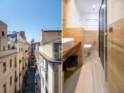 a bathroom with a view of a city at AinB Born-Dames Apartments in Barcelona