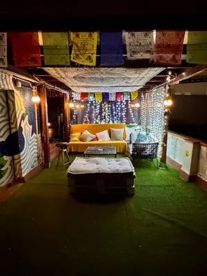 a room with a couch in a room with lights at Casa Clot in Barcelona
