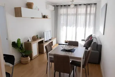 a living room with a table and a couch at Apartments BCN Central-Drassanes in Barcelona