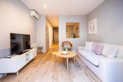a living room with a white couch and a table at B3MAL1081- New 2BR flat with private terrace in Barcelona