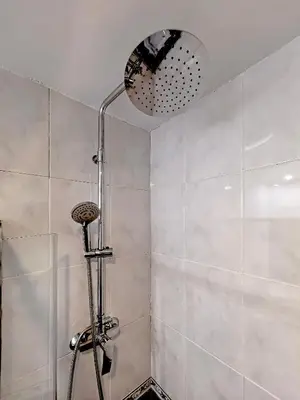 a bathroom with a shower with a shower head at Classbedroom Barcelona Sagrera Apartment in Barcelona