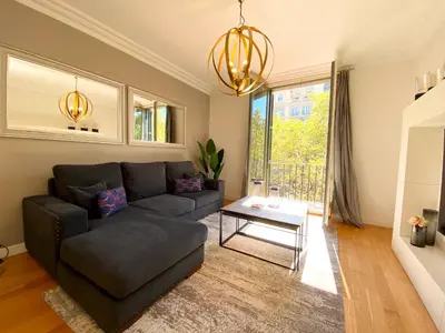 a living room with a couch and a table at Spacious Elegant on Avenue Diagonal By MyRentalHost in Barcelona