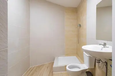 a bathroom with a toilet and a sink at BRAND NEW Pl Espana Sants Fira Apartment 2024 Built, Aplus, AirCon & Heating, Gigabit WiFi, Parking in Barcelona