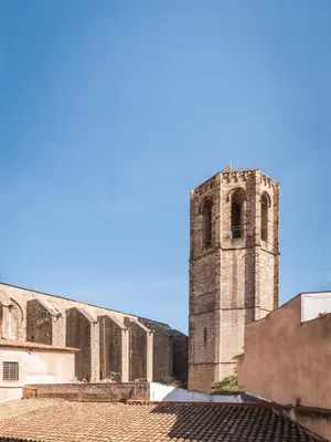 an old building with a tower on top of it at BYPILLOW Twenty in Barcelona