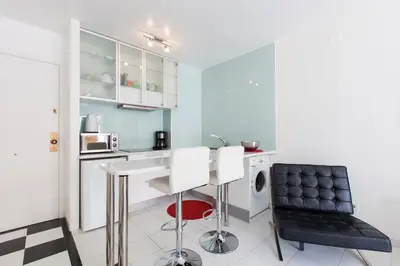 a kitchen with a table and two chairs at Viva Sitges - Mayo Terrace in Sitges