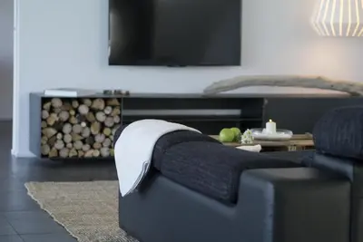 a living room with a couch and a tv at Holiday Home Alexander Plana in Pallejá