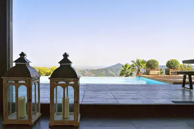 a view of a pool from a house with two lights at Holiday Home Alexander Plana in Pallejá