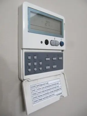 a white fax machine is attached to a wall at Torre Forum in Sant Adria de Besos