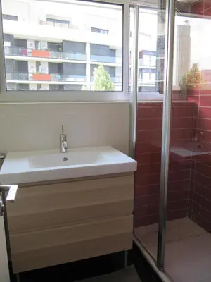 a bathroom with a sink and a shower at Torre Forum in Sant Adria de Besos