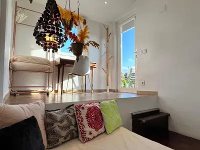 a living room with a couch and a table at Diamond Rooftop & private terrace sea views in Barcelona