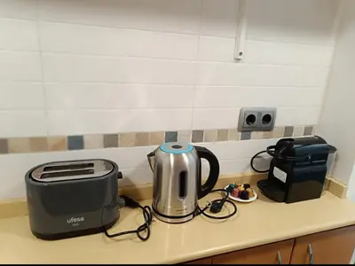 a kitchen counter with a toaster and a toaster and a toaster at 2 Habitaciones Hospitalet in Hospitalet de Llobregat