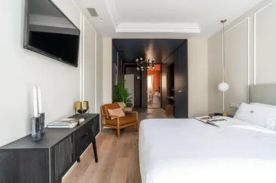 a bedroom with a bed and a desk and a chair at Rental Apartment Barcelona in Barcelona
