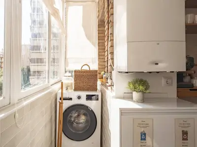 a laundry room with a washing machine and a window at Camp Nou Stadium Apartment in Barcelona