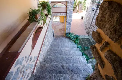 a stairway in a building with a stone wall at Vacarisses- Torreblanca Estacin in Vacarisas