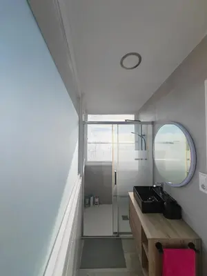 a bathroom with a sink and a mirror at Apartamento con vistas al mar in Viladecáns