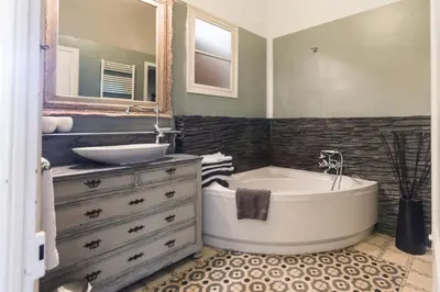 a bathroom with a tub and a sink at Romantisches Fischerhaus am Meer, 200 m vom Strand, Barcelona in Premiá de Mar