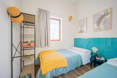 a bedroom with a bed and a bunk bed at The Nest Masia Can Tiranasi Relájate y Disfruta Escapada con Encanto Cerca de Barcelona- in Badalona